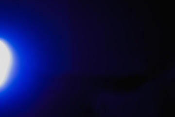 Ray of lamp spot light over black background, square stage abstract illumination