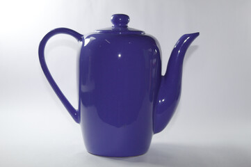Blue ceramic milk jug with white background
