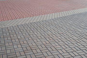 Perspective view of gray and red paving slabs.