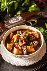 Deer stew in a bowl hunting weapon as a decoration