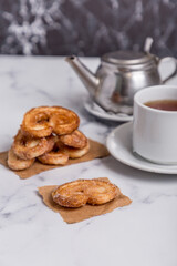 tea with milk and Palmiers cookies on marble