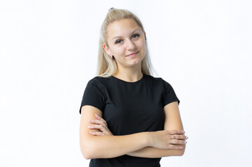 portrait of a girl with fair hair, looking with satisfaction at camera, being happy. Beautiful woman isolated against blank studio wall.