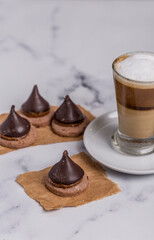 Coffee with milk and Dulce de Leche cones with sweet chocolate cones