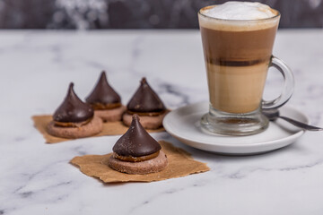 Coffee with milk and Dulce de Leche cones with sweet chocolate cones