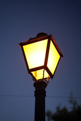 Lamppost in the night with yellow screen