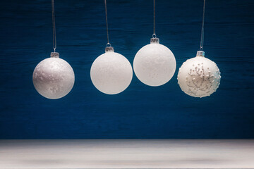 Christmas baubles over blue wooden background. Xmas and New Year concept