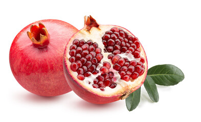 pomegranate with half of pomegranate and green leaves isolated on a white background