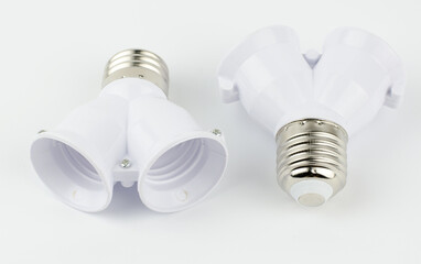 Adapter for two lamps on a white background.