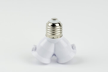 Adapter for two lamps on a white background.