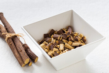 Licorice medicinal plant root, on white background