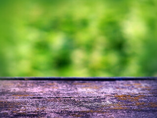 table top old dark color macro structure on green blurred background, space for products