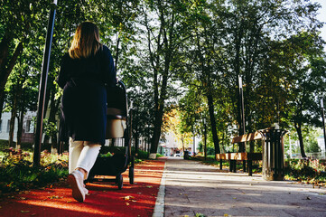 girl walking with a child in an autumn park