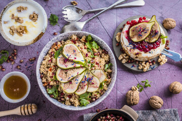 top view of gourmet dish with Figs fruits, nuts, honey, couscous and pomegranate seeds on table