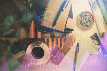 Double exposure of forex graph drawing and work table top veiw. Concept of financial analysis.