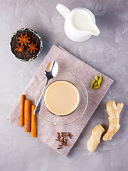 Masala chai tea. Traditional indian drink - masala tea with spices on gray background. Top view