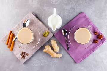 Masala chai tea. Traditional indian drink - masala tea with spices on gray background. Top view