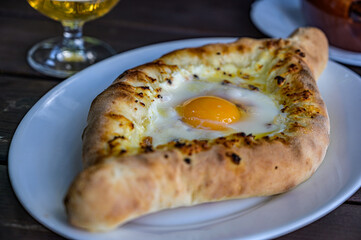 Baked bread with cheese and egg filling. khachapuri is a traditional Georgian cuisine.