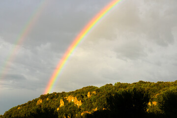 rainbow over Beautiful small village Montclus in Department Gard in Southern France