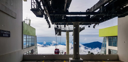cable car at station at genting highlands, malaysia in a foggy weather