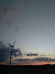 Wind turbine at sunset - Éolienne  - 378443221