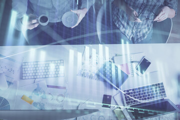 Double exposure of man and woman working together and financial chart hologram drawing. market analysis concept. Computer background. Top View.
