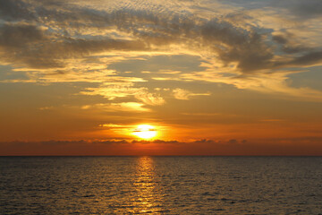 Fototapeta na wymiar Photo of the beautiful a warm sunset on the sea.