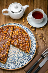 Dessert from the menu of a French restaurant. On a wooden table
