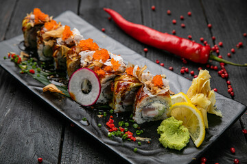 Japanese rolls with salmon, tuna on a wooden table
