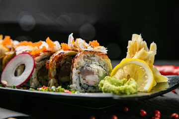 Japanese rolls with salmon, tuna on a wooden table
