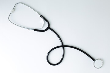 Black stethoscope depicted on a white background