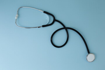 Black stethoscope depicted on a blue background