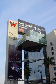 Big Red W and Drais signs with ads for Aziz Ansariand Acura on the side of the Modern W Hotel Hollywood building