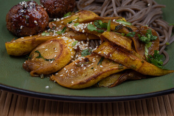 Soba, vegan tsukune and tariyaki squash along with dipping sauce