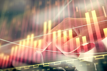 Multi exposure of man's hands holding and using a phone and financial chart drawing. Market analysis concept.