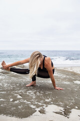 young woman yoga at the beach