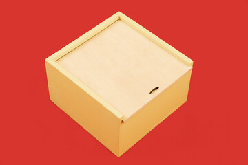 wooden box for gift small object on red simple background empty copy space for your text