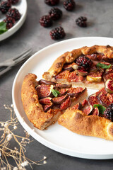 Close up slice of galette with fresh figs. Traditional rustic fruit homemade pie, top view.