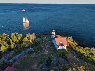 Aerial Drone image of the Curtis Island Lighthouse att he entrance to Camden Harbor on Penobscot...