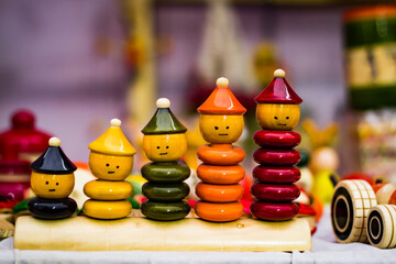 colourful ring toy stacking doll figures with increasing sizes