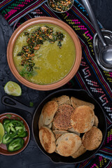 Vegan green peas and buckwheat plinis on dark backround