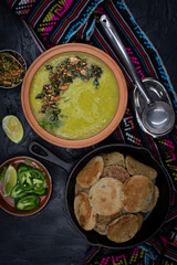 Vegan green peas and buckwheat plinis on dark backround