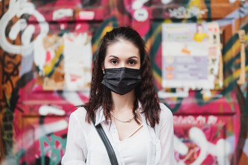 Young woman in a black mask. Protection against сovid-19