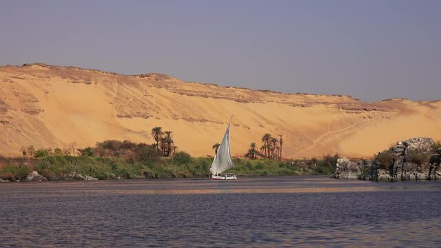 Beautiful landscape with felucca boat on Nile river near Aswan, Egypt, 4k
