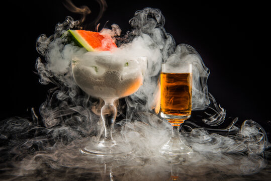 dangerous smoking cocktail on black background for Valentine's Day