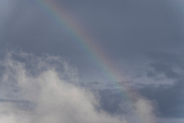 Rainbow in rural area of Guatemala, rain and mountains in open space, natural phenomenon.