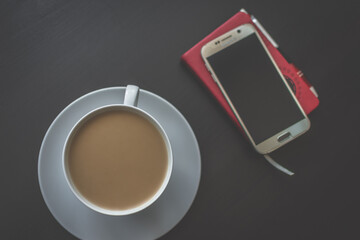 Coffee and smartphone on schedule