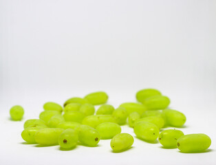 Green grape without branches and leaves isolated on white. With clipping path. Full depth of field.