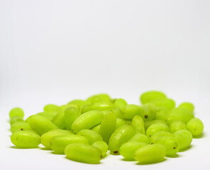 Green grape without branches and leaves isolated on white. With clipping path. Full depth of field.