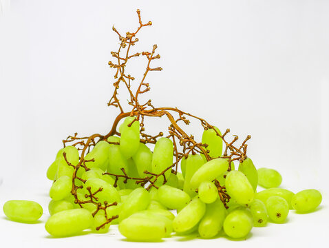Green grape with branches isolated on white. With clipping path. Full depth of field.