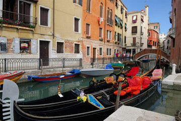 Plush gondolas moored at Rio dei Fraro at Campo dei Frari Venice